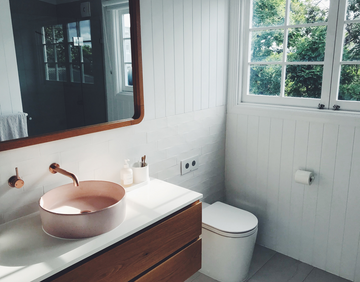 bathroom interior with white panelled walls