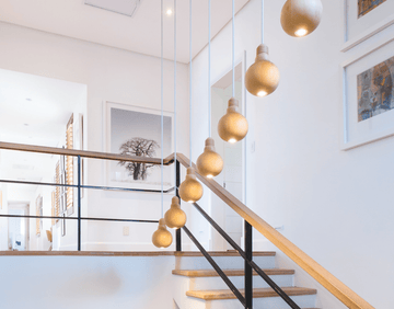 contemporary home with pendant lights in stairway