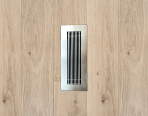 kul grilles brushed chrome vent cover on hardwood floor