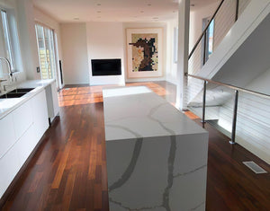 waterfall island counter featuring kul grilles anodized clear floor vent covers in modern kitchen design