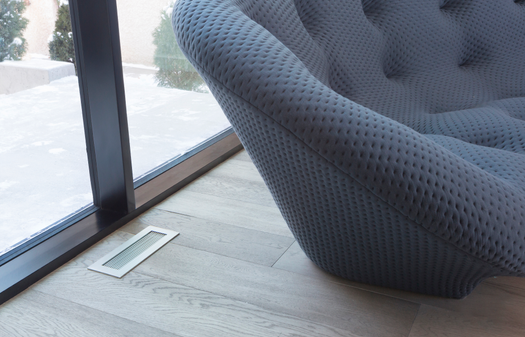 BRUSHED CHROME FLOOR REGISTER IN LIVING ROOM