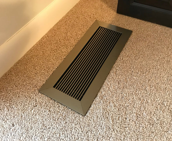 vent covers anodized light bronze on carpet close up Donald Koliha