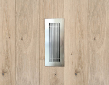 kul grilles brushed chrome vent cover on hardwood floor