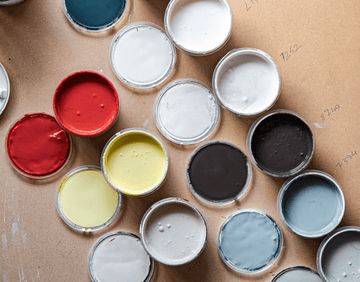 variety of paint colours in cans min