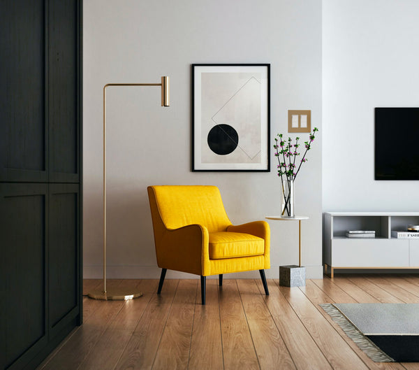 anodized matte gold light switch in modern living room space