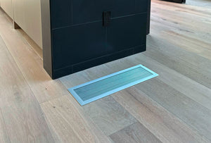 Modern Brushed Chrome vent cover on light hardwood floor