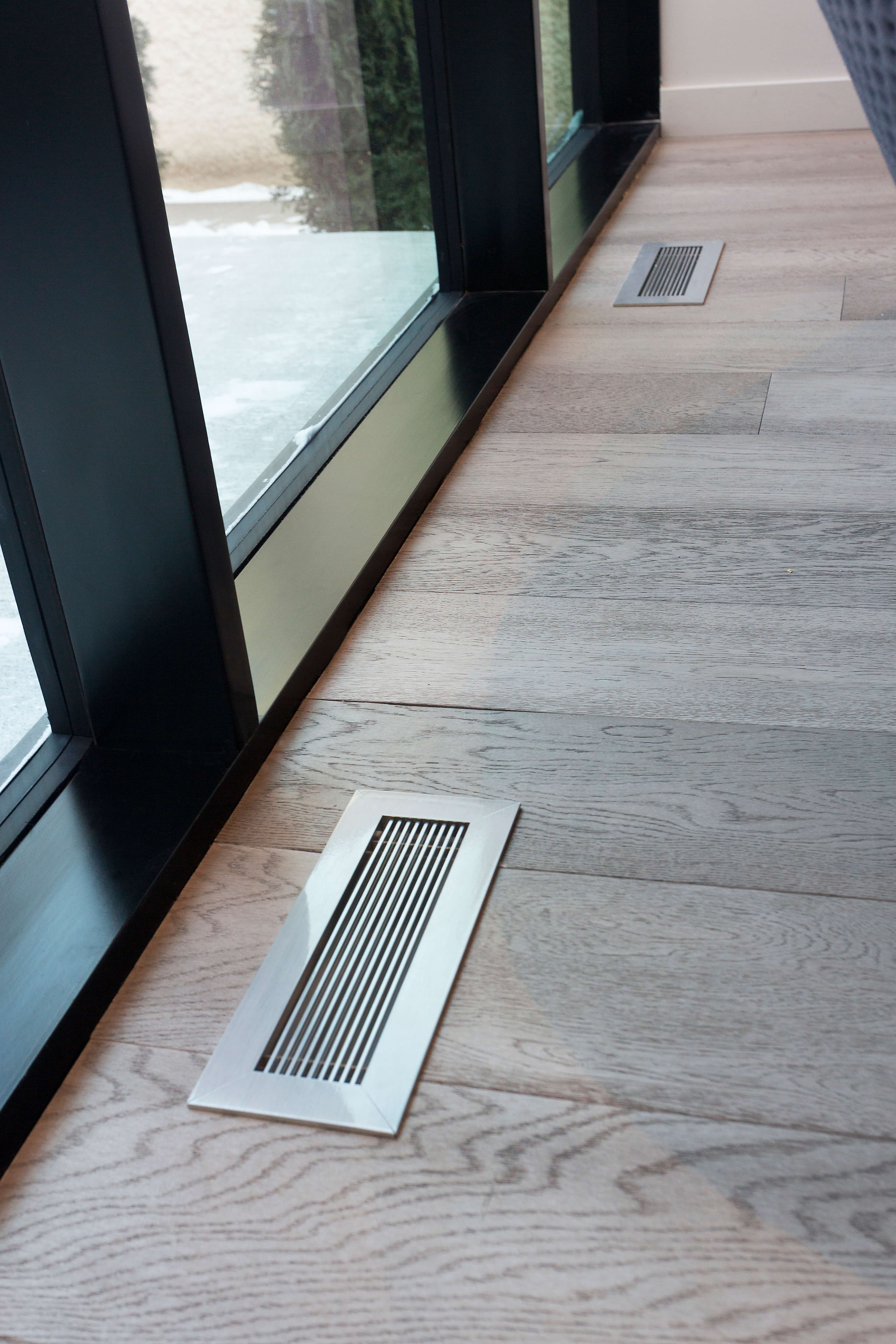 Air Vent Covers Brushed Chrome Finish On Light Oak Floor Black Window Casing by kulgrilles